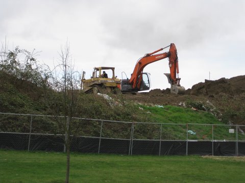 Removal of the earthen wall at Jefferson Park on Spokane Street. Photo by Joel Lee.