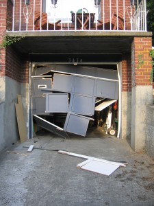 The damage left behind when the Cherokee rammed its way out. Photo by Rob.